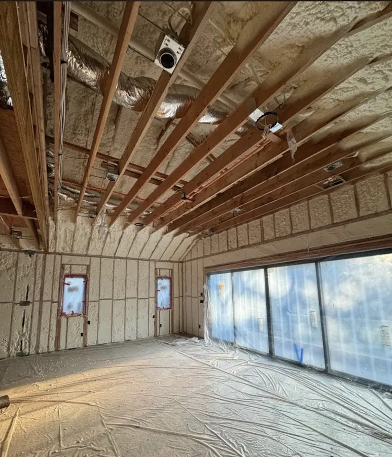 Interior walls and ceiling insulated with spray foam during new construction in Parkville